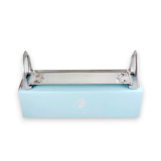 The Arthur Court equestrian stirrup serving tray resting elegantly on top of its signature light blue packaging box.