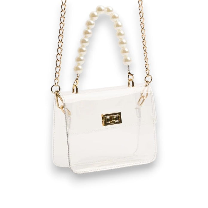 An alternate view of the clear stadium bag showcasing both the pearl wristlet and the long gold chain strap.