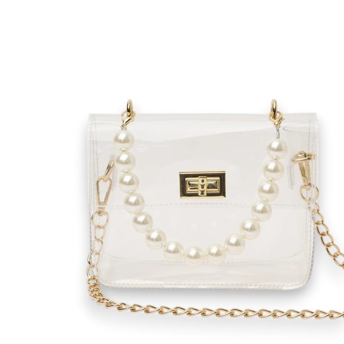 The Audrey clear crossbody bag with a pearl handle and gold chain strap shown from the front against a white background.