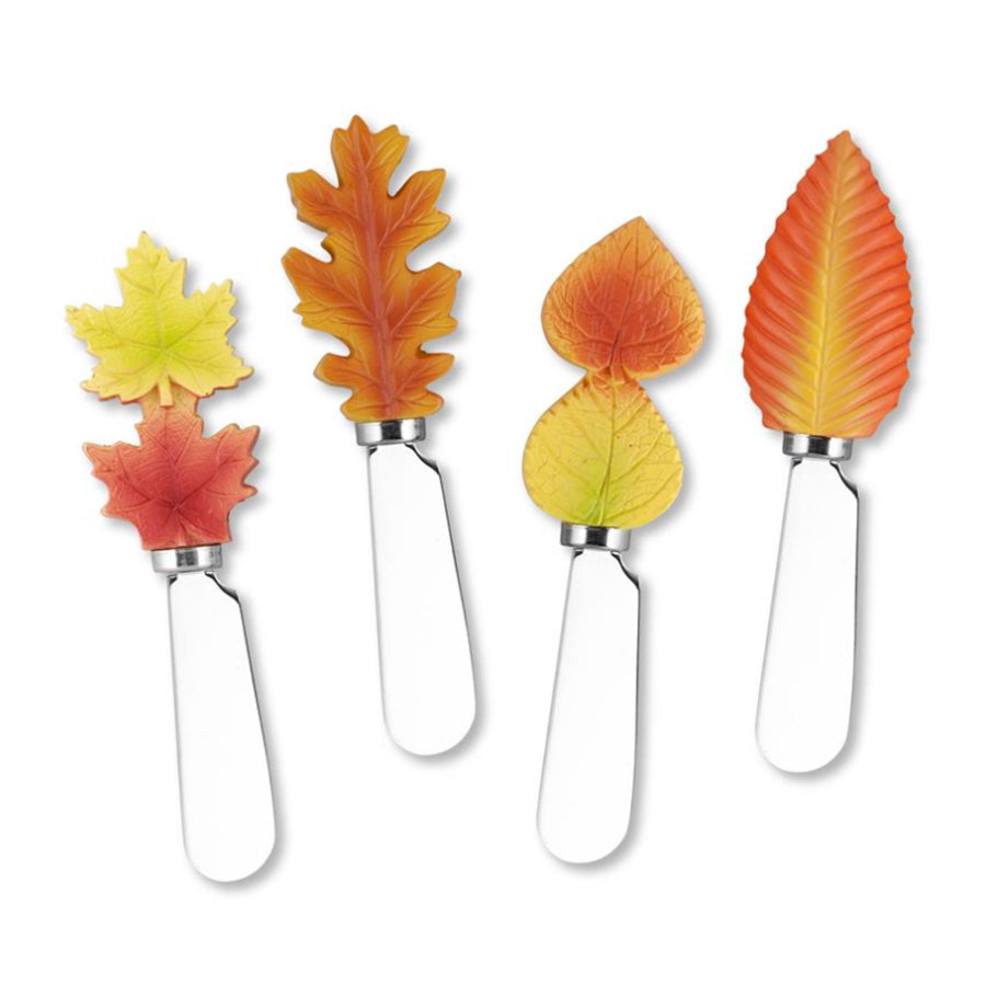 Set of five leaf-shaped cheese knives on a white background