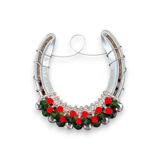 A detailed shot of the "Baby Roses" style horseshoe with petite flowers and sparkling gems.