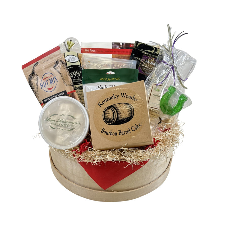 The Barrel of Goodness Kentucky gift basket displayed in a round wooden container, packed with local snacks, candies, and bourbon treats.