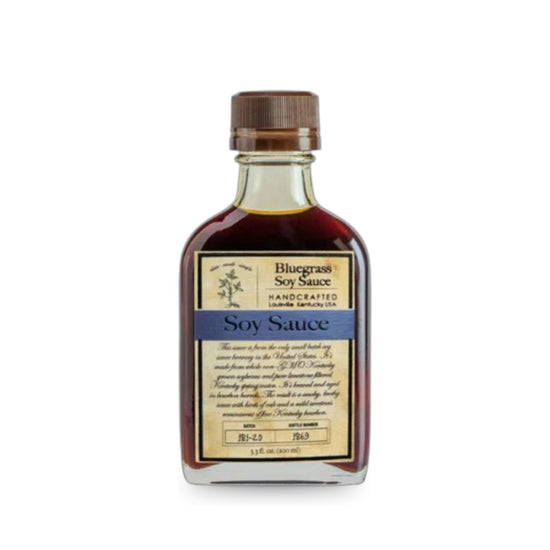 Front view of Bluegrass Soy Sauce in a small flask bottle with vintage-style label