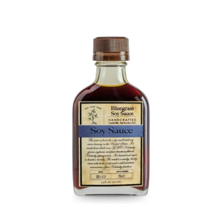 Front view of Bluegrass Soy Sauce in a small flask bottle with vintage-style label