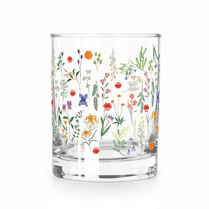 A clear Double Old Fashioned glass featuring a vibrant, multicolored boho floral pattern.