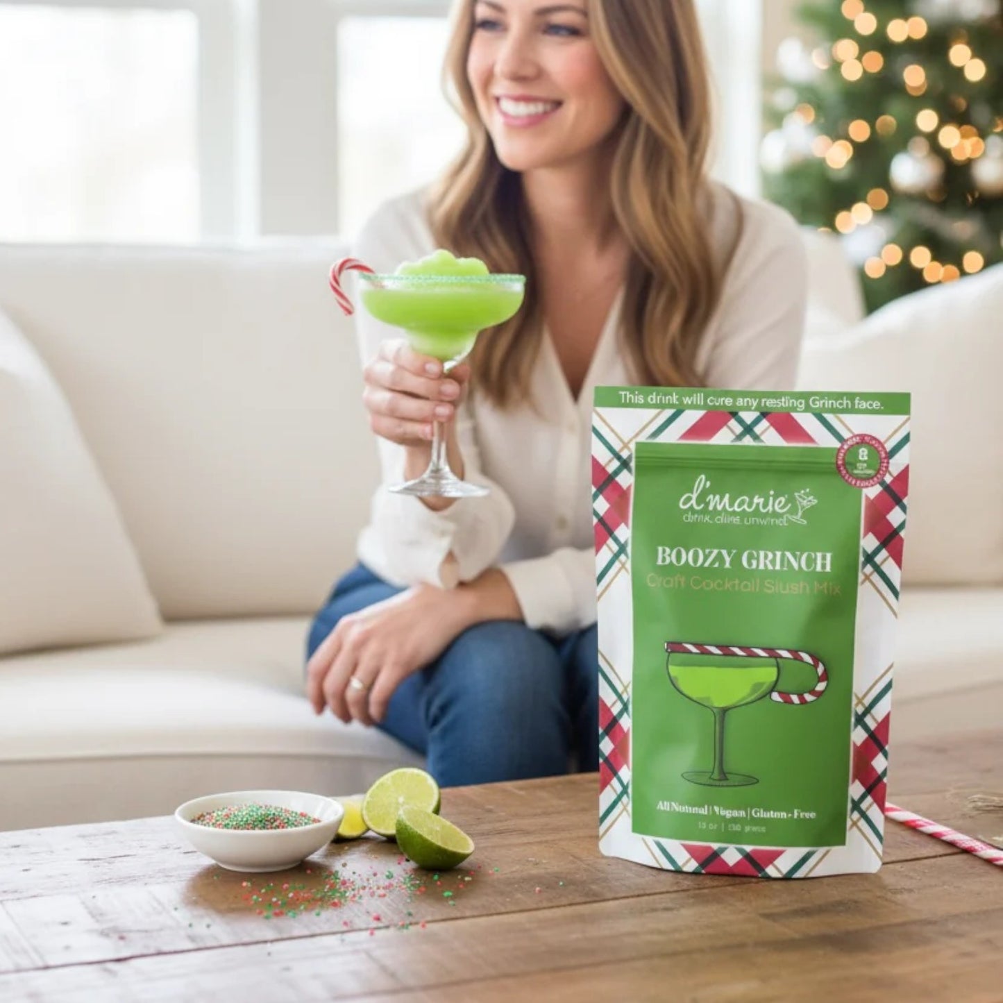 The "Boozy Grinch" green cocktail slush mix pouch with a prepared drink.