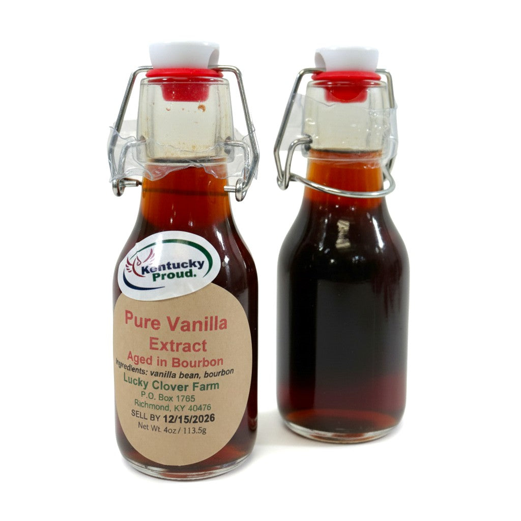 A 4oz swing-top bottle of pure vanilla extract aged in bourbon, displaying a rich amber color.