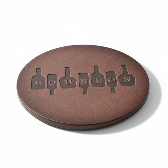 Detail shot highlighting the textured surface and durable stitching of the genuine leather bourbon coaster.