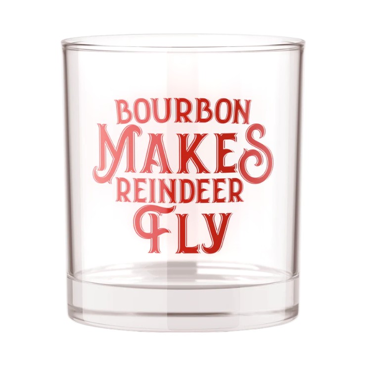 The "Bourbon Makes Reindeer Fly" rocks glass on a white background.