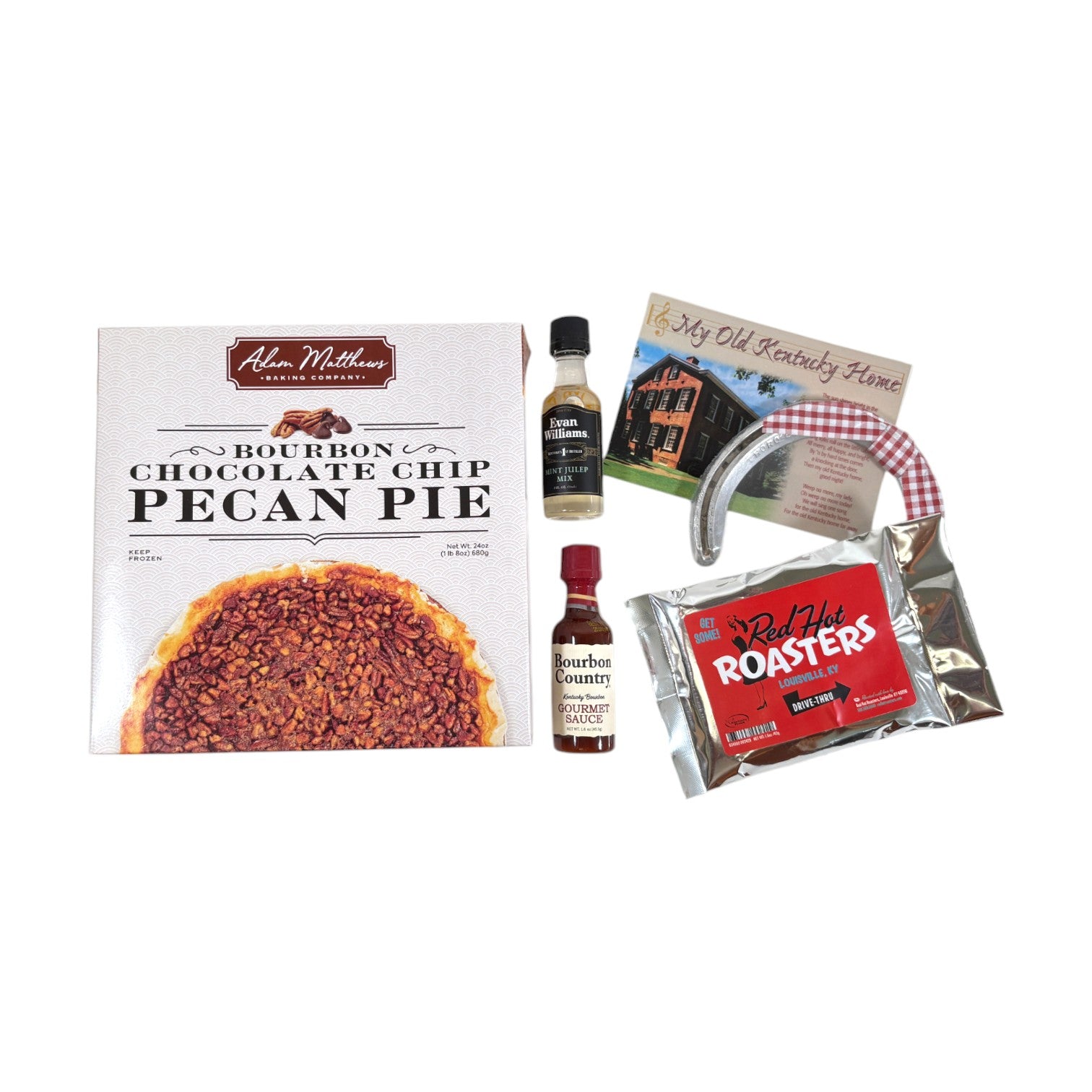 A top-down view of the gift set contents including a Bourbon Chocolate Chip Pecan Pie, mint julep mix, and a horseshoe.