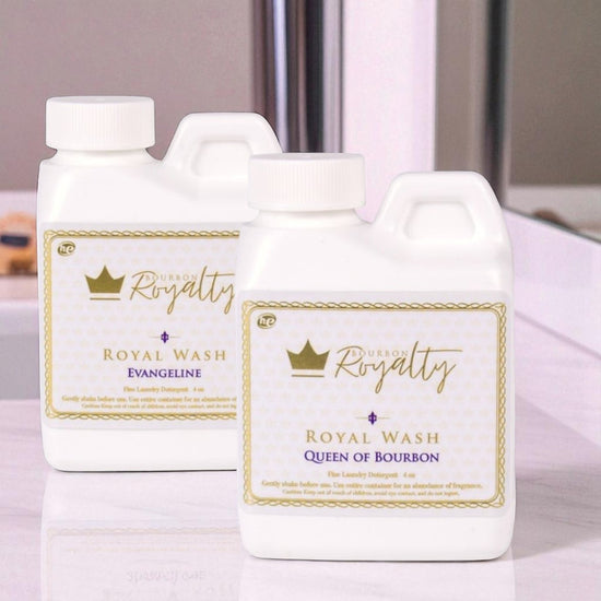 Two bottles of 'Royal Royalty' laundry detergent on a light background