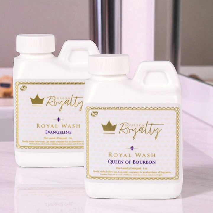 Two bottles of 'Royal Royalty' laundry detergent on a light background