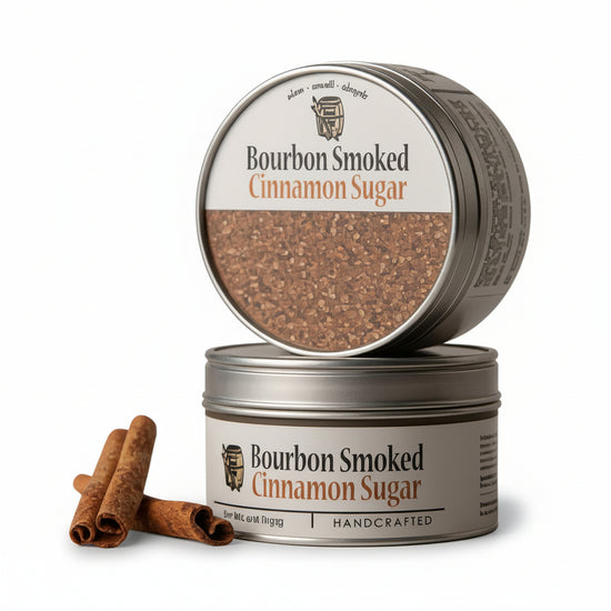 Two tins of Bourbon Smoked Cinnamon Sugar with cinnamon sticks on a white background
