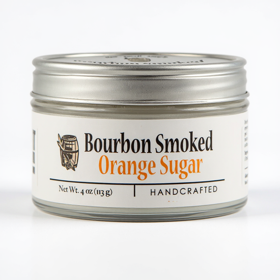 Jar of bourbon smoked orange sugar with a white label on a white background