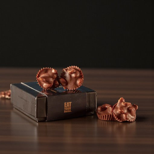 A charming 4-piece gift box of Bourbon Smoked Salt & Pepper Peanut Clusters.