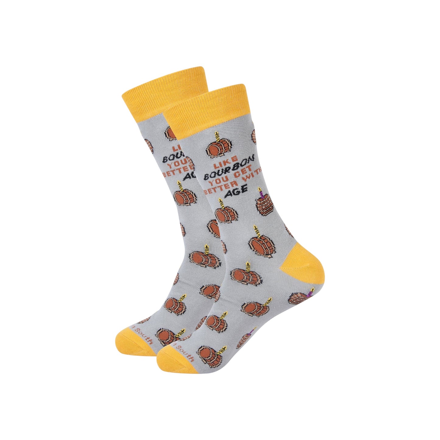 Gray socks with bourbon barrel patterns and yellow accents on a white background