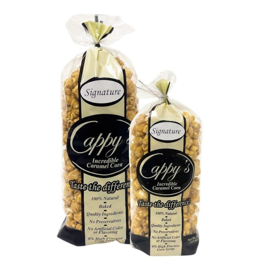 Two bags of Cappy Incredible Caramel Corn on a white background