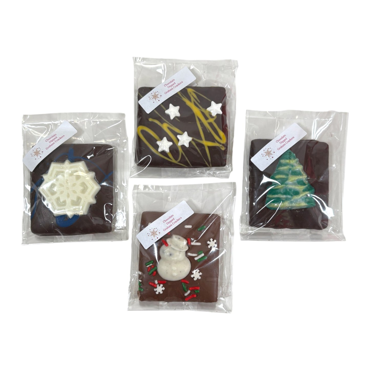 An assortment of four Chocolate Covered Christmas Graham Crackers with different festive designs.