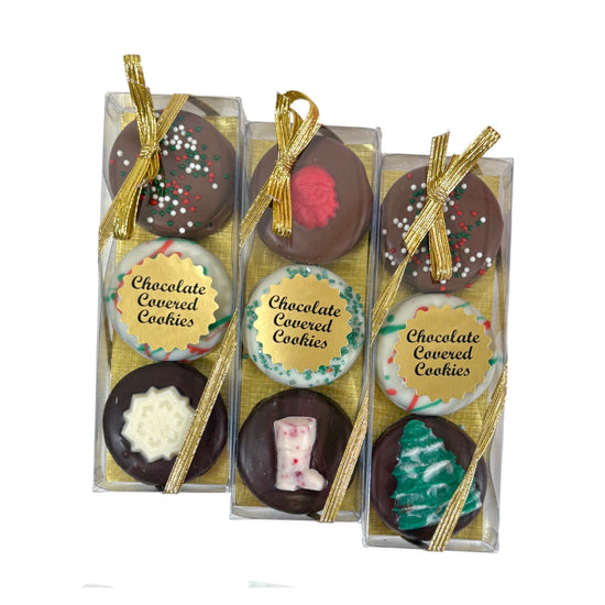 Three chocolate Oreos showing milk, dark, and white chocolate varieties with holiday decorations.