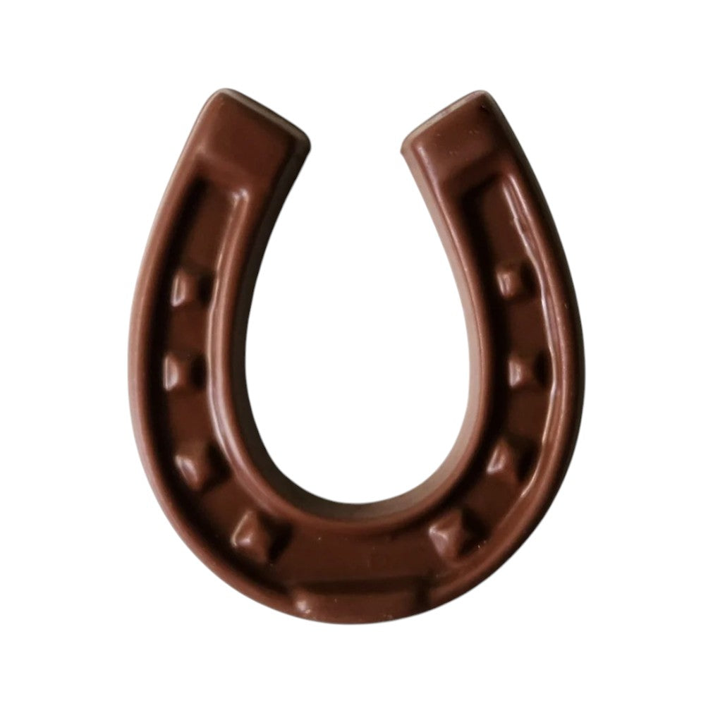 Brown dark chocolate horseshoe on a white background
