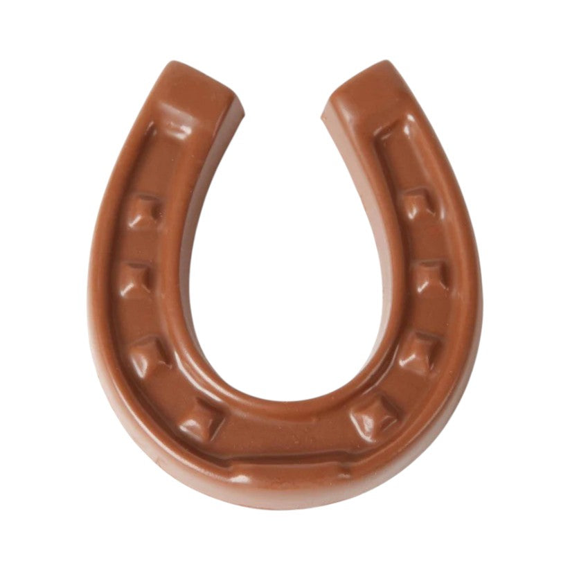 Brown milk chocolate horseshoe on a white background