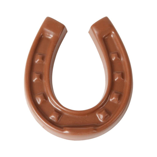 Brown milk chocolate horseshoe on a white background
