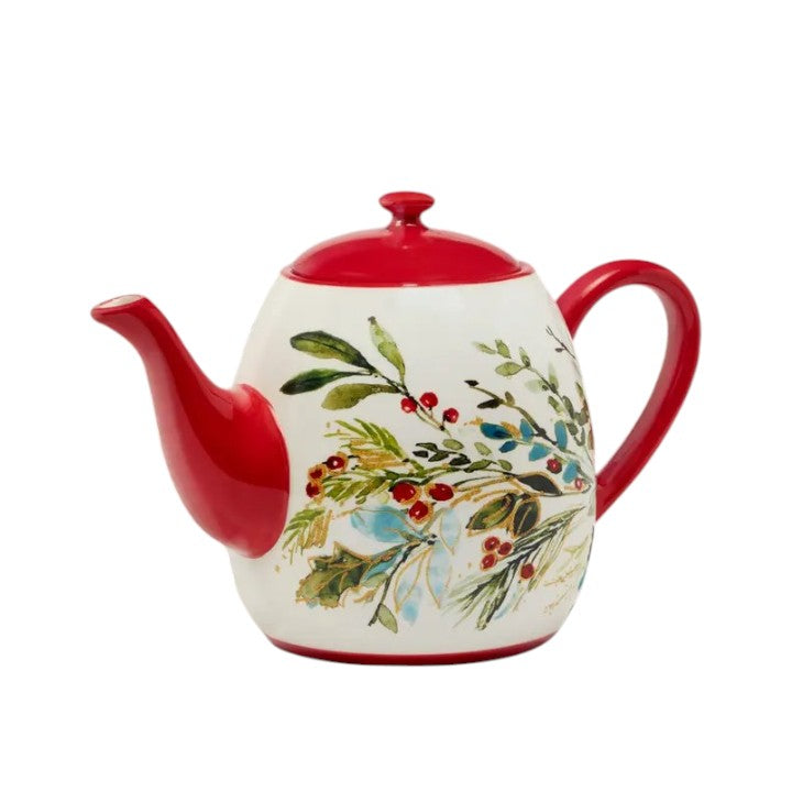 Ceramic teapot with red accents and floral design on a white background