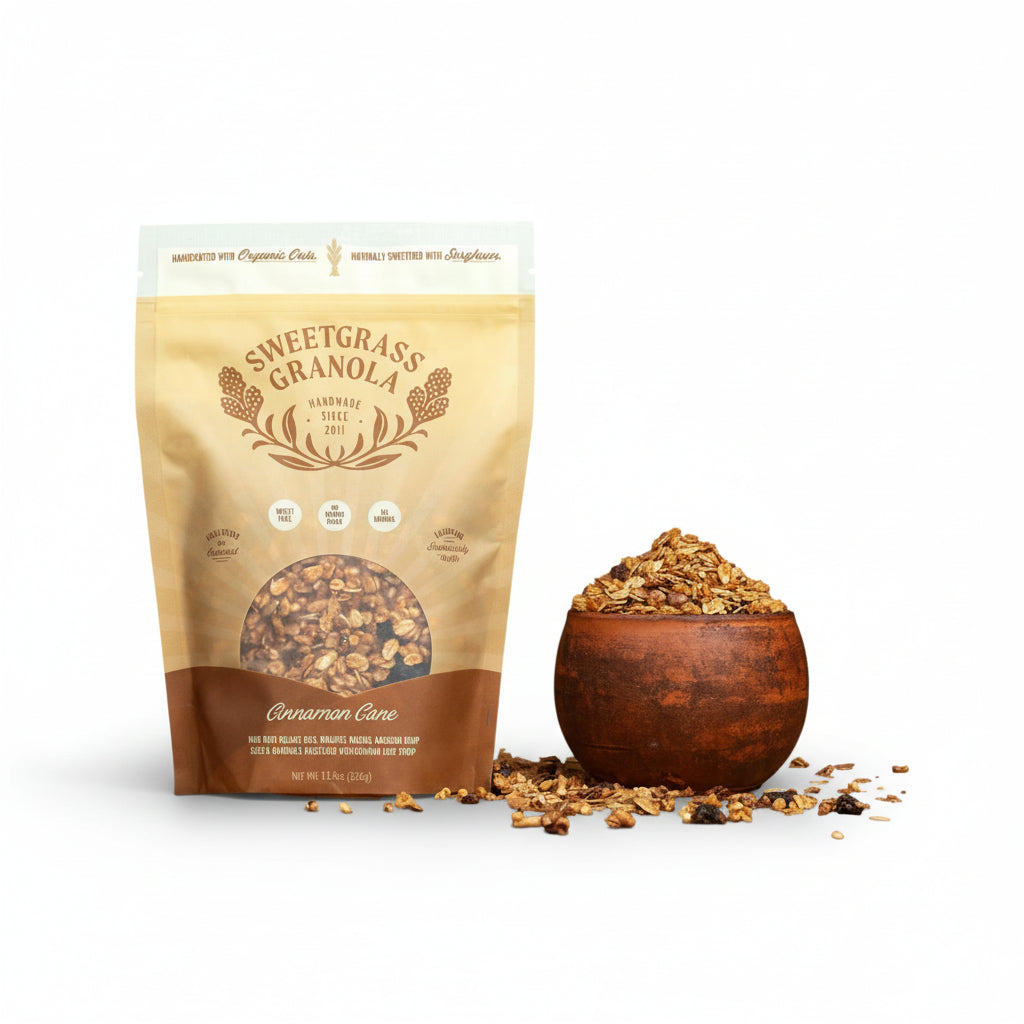 Sweetgrass Granola package with a wooden bowl of granola on a white background
