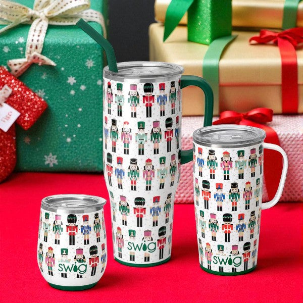 Lifestyle image showing the Classic Nutcracker drinkware collection staged with festive Christmas gifts.