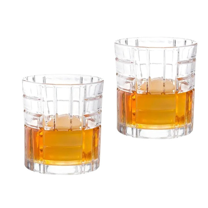 Classic 10 oz whiskey glass with faceted grid texture and ice.