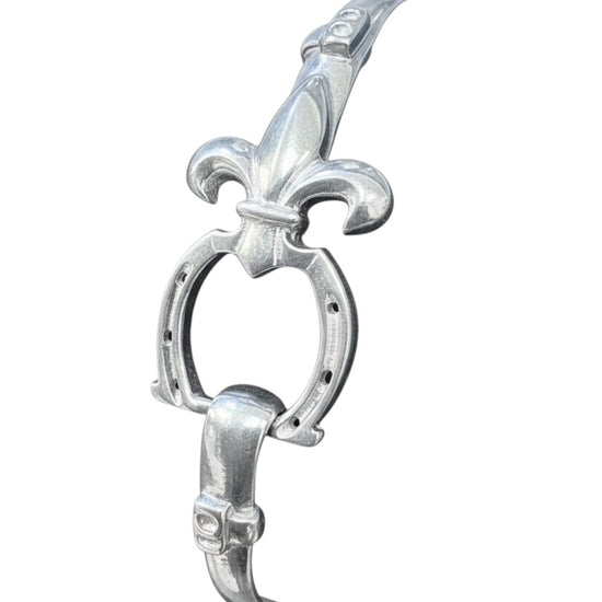 Silver bracelet with a fleur-de-lis design on a white background