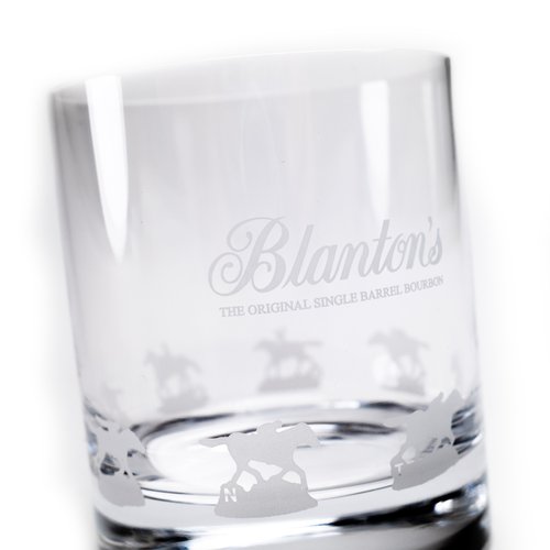 A close-up detail shot of the handcrafted, frosted etching of the galloping horses on the Blanton's Glencairn glass.