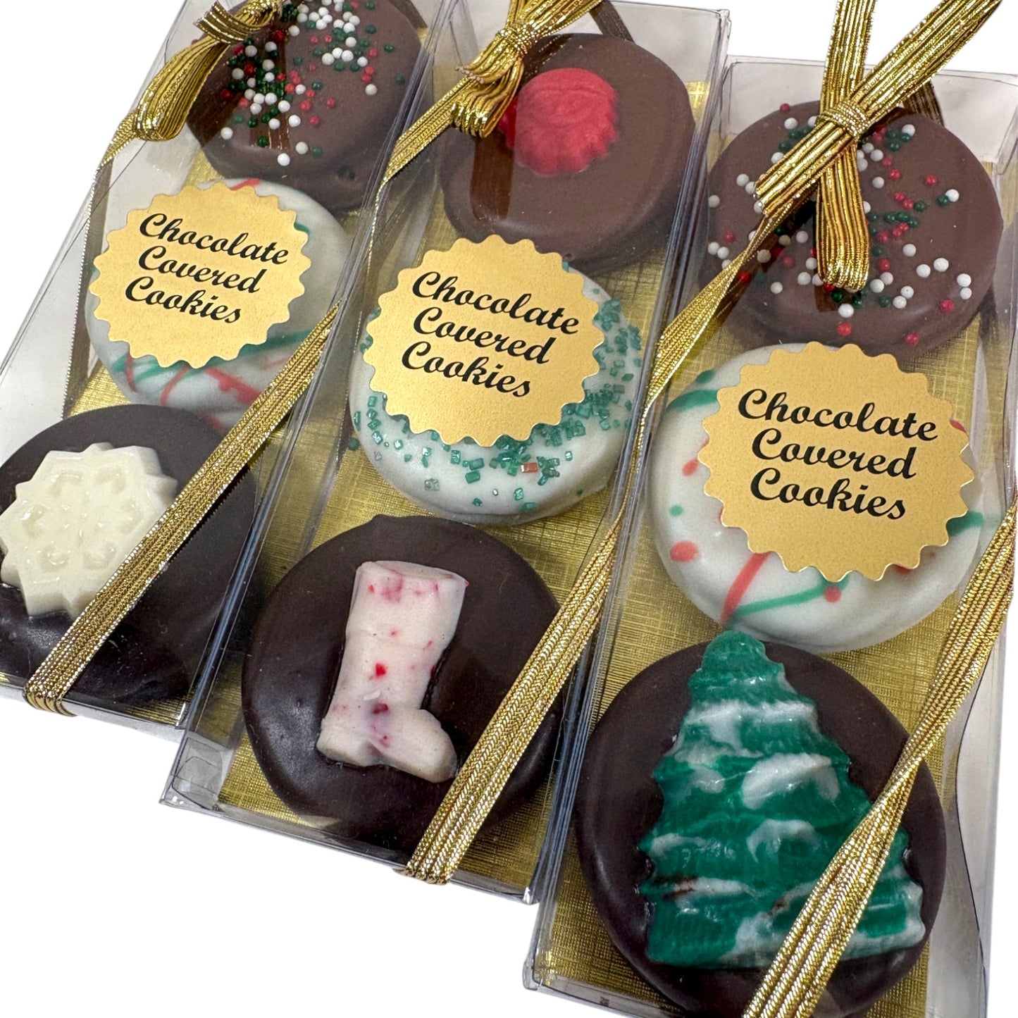 Assorted chocolate-covered cookies in clear packaging with gold ribbons.
