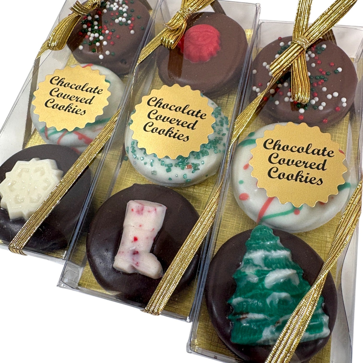 Assorted chocolate-covered cookies in clear packaging with gold ribbons.