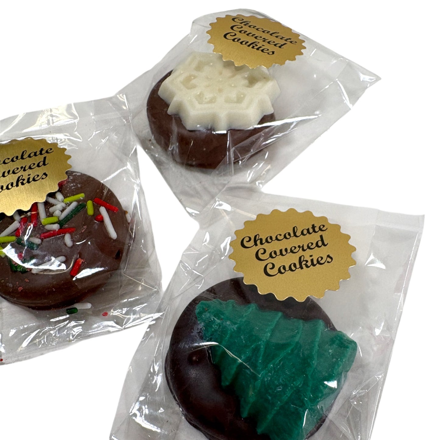Three packages of chocolate-covered cookies with decorative toppings on a white background.