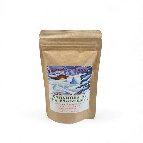 Kentucky Mountain Coffee Company packaging with a snowy mountain scene on a white background