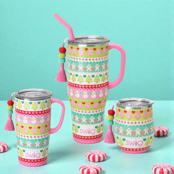 Lifestyle image showing the Cookie Jar drinkware collection on a blue background with peppermint candies.