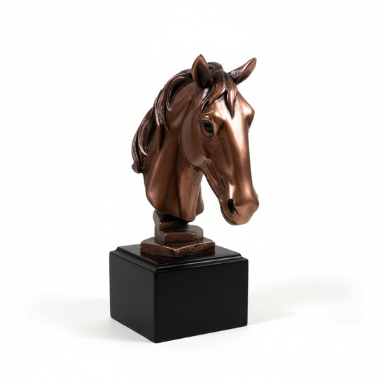 The elegant copper horse head sculpture mounted on a gallery wall, adding a sophisticated equestrian touch.