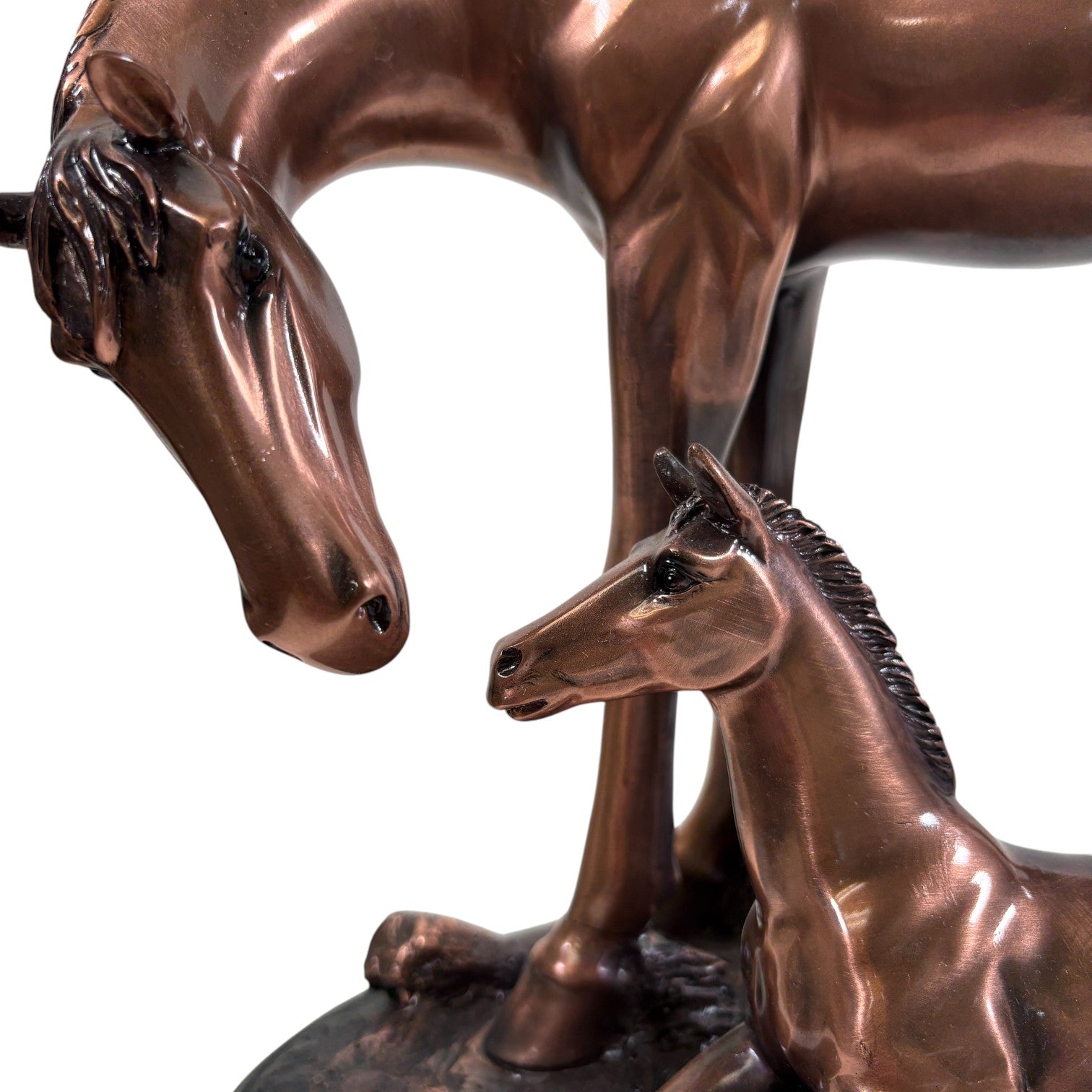 A close-up showing the rich copper texture and heartwarming design of the mother and foal sculpture.