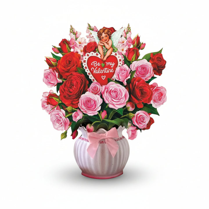 The Cupid's Valentine pop-up card fully opened and standing, displaying a beautiful bouquet of red and pink roses and snapdragons.