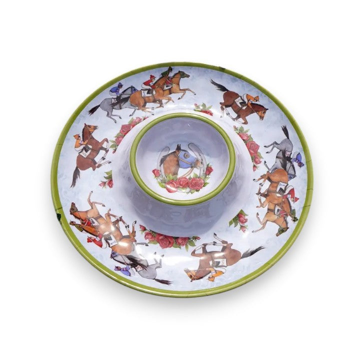 A top-down view of the "Day at the Races" 14.5-inch round melamine chip and dip platter, showcasing the outer ring of galloping horses and a central bowl with a horse head and horseshoe design.