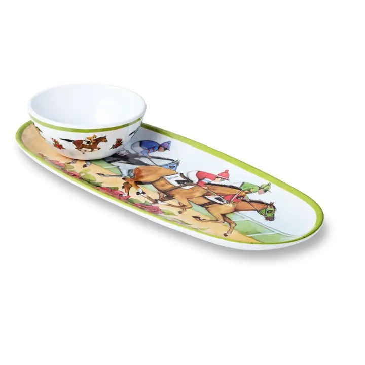 A studio shot of the white melamine "Day at the Races" oval tray and integrated dip bowl, featuring colorful horse racing artwork and a vibrant lime green rim, on a plain white background.