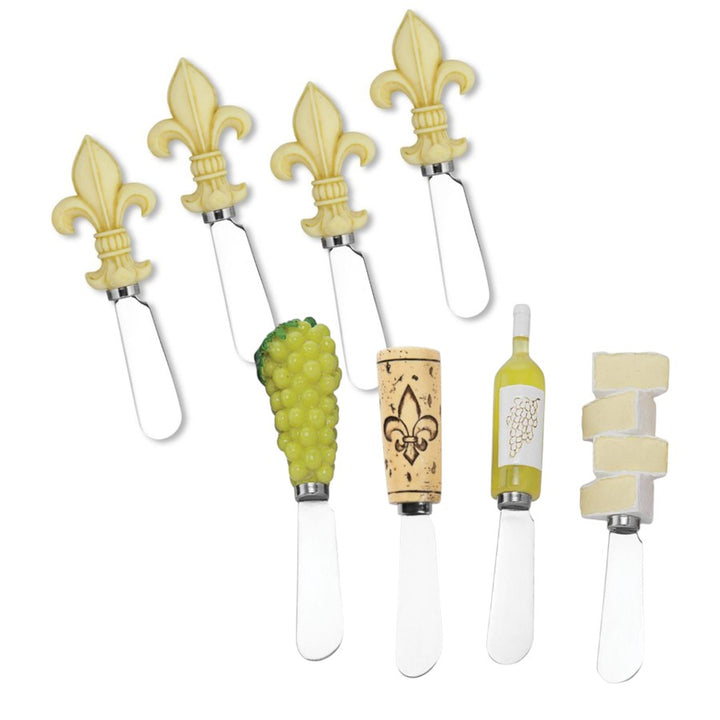 Set of four cheese knives with decorative handles on a white background