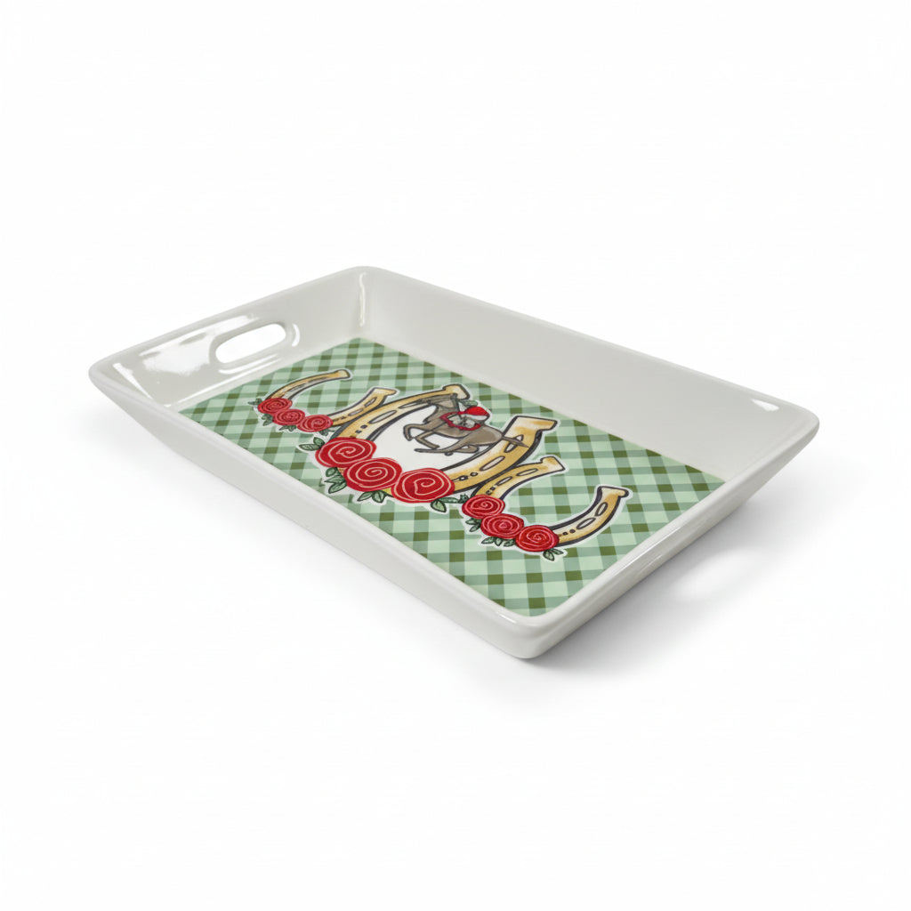 Decorative tray with a checkered pattern and horse shoe design on a white background