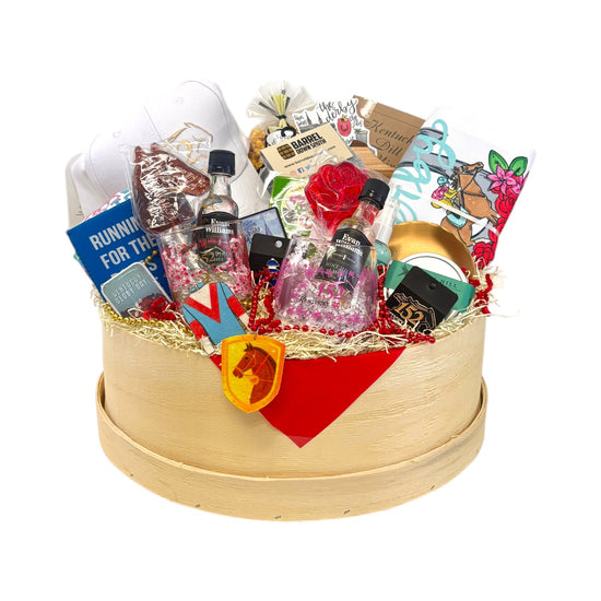 Gift basket filled with Derby party essentials—glasses, snacks, socks, and Derby-themed towel.