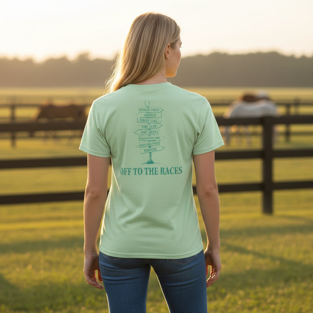 A model wearing the unisex spearmint green Kentucky Derby 152 signpost t-shirt in a casual, outdoor setting.
