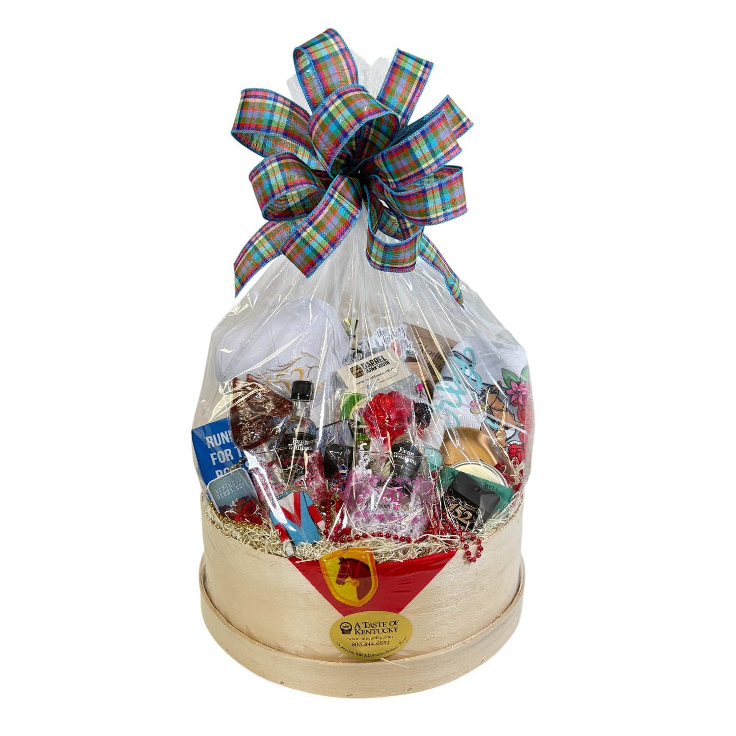 Themed gift basket wrapped with a plaid bow showing Derby 152 cap, treats, drinks, and accessories.