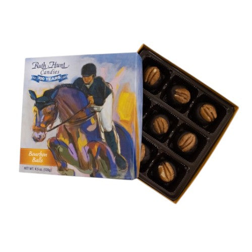 Box of bourbon balls with a horse and rider label on a white background