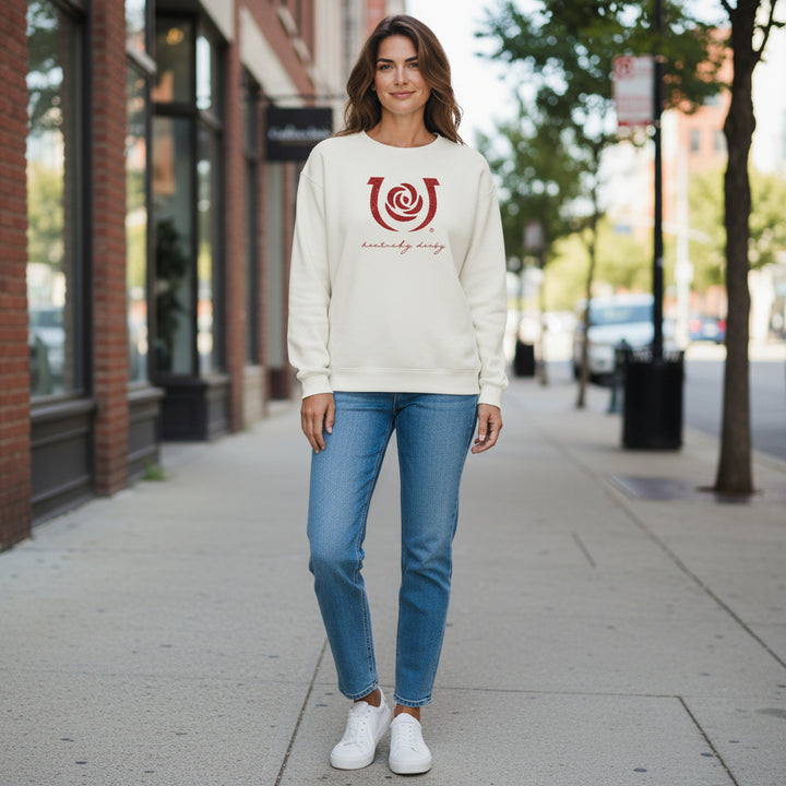  A model wearing the relaxed fit Kentucky Derby 152 corduroy crew neck in an urban setting, styled with jeans and sneakers.