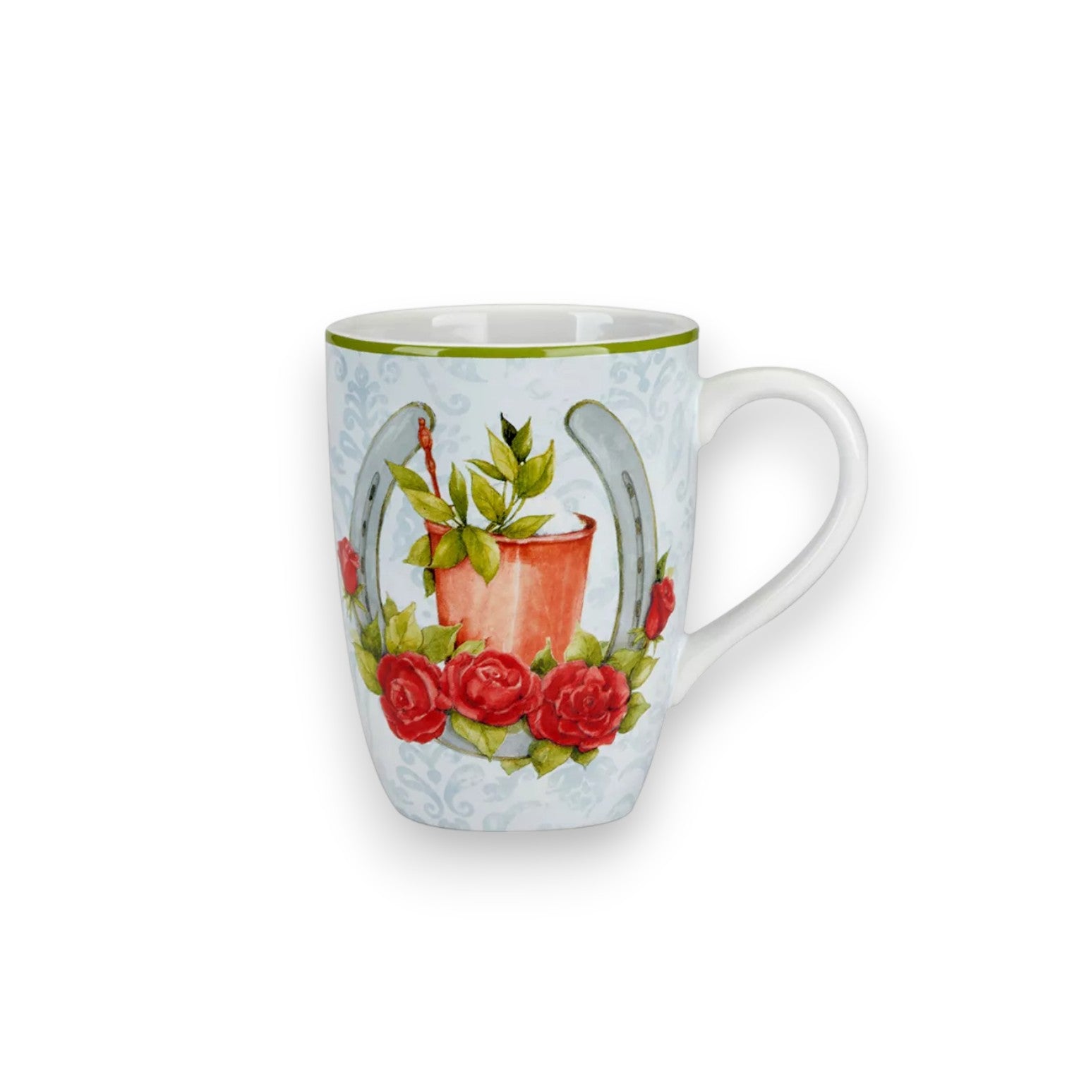 Close-up of a stoneware mug showing a horseshoe and rose design on a white background